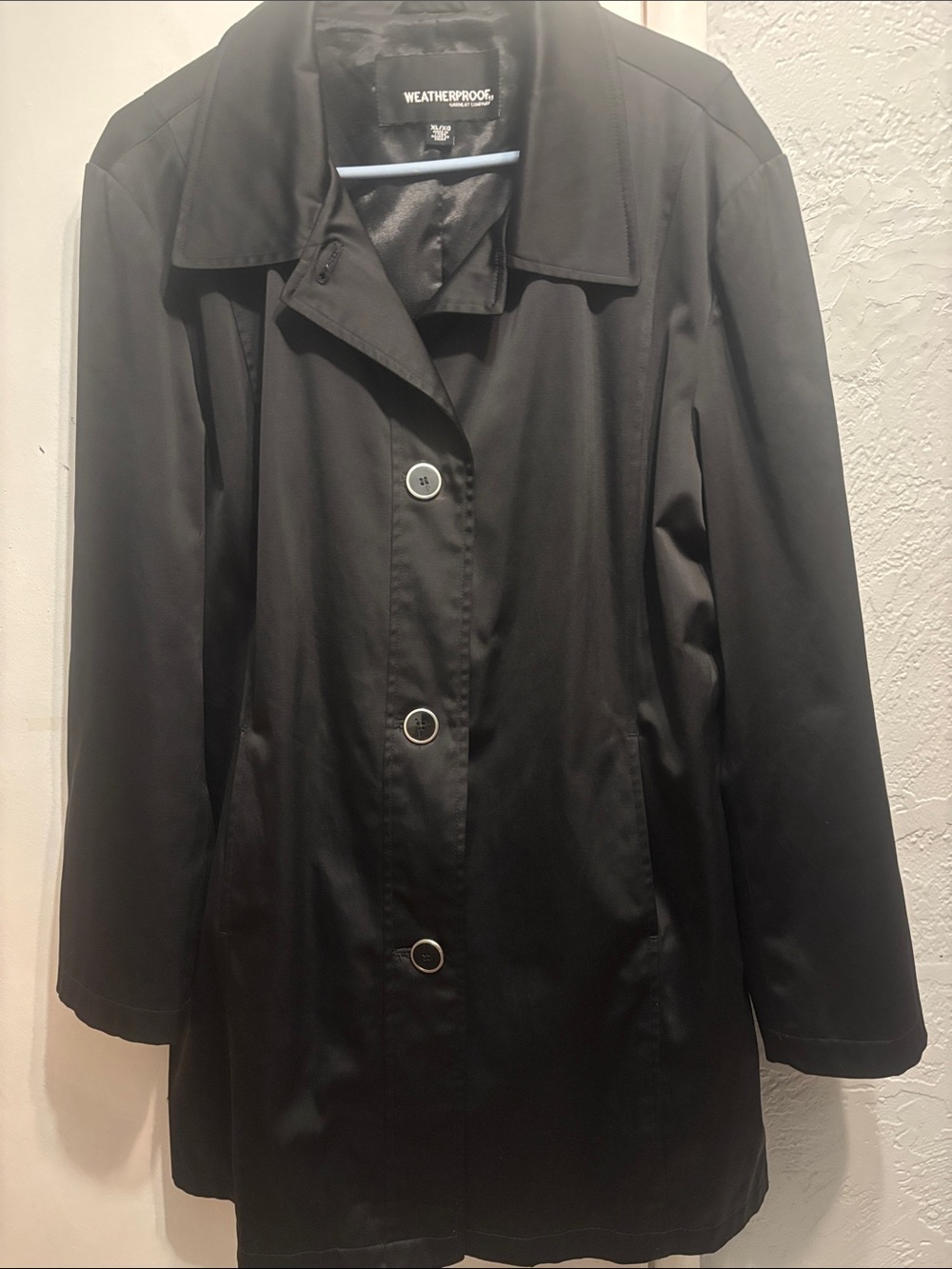 Weatherproof Women’s Black Trench Coat with Button Front knee length.
